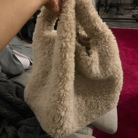 I could spend all day in there. What do you guys think of my  Revolve Fur bucket bag